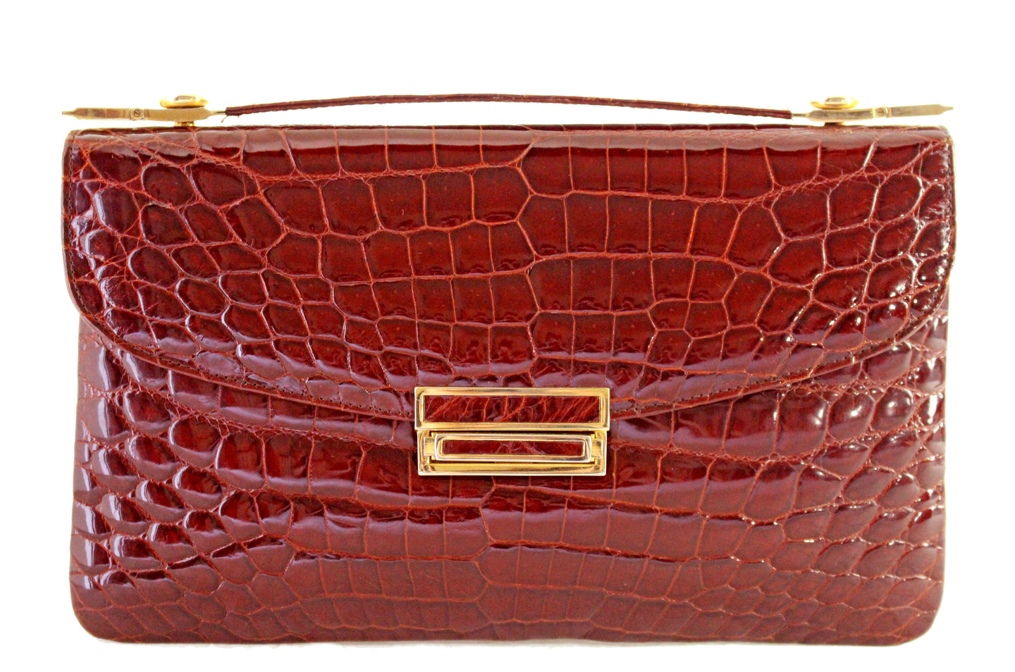 Rectangular cognac color crocodile skin handbag