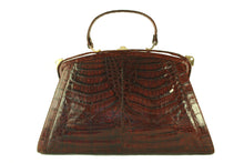 Sizable reddish-brown crocodile skin handbag
