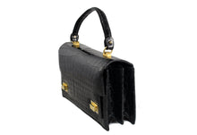 Jet black crocodile skin handbag with flap and double clasp