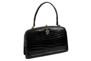 Small black crocodile skin handbag with skin lined frame