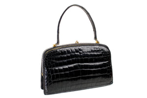 Small black crocodile skin handbag with skin lined frame