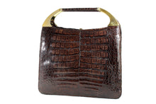 Brown crocodile skin handbag with decorative handles