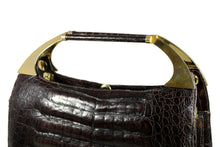 Brown crocodile skin handbag with decorative handles