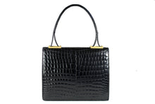 Jet black baby crocodile handbag with decorative handle