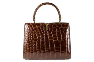 Glossy brown crocodile skin frame handbag