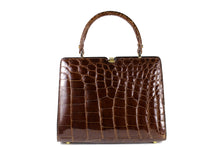 Glossy brown crocodile skin frame handbag