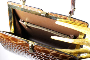 Glossy brown crocodile skin frame handbag