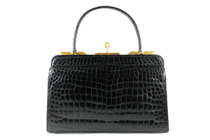 Black crocodile skin handbag with lined frame and key lock