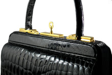 Black crocodile skin handbag with lined frame and key lock