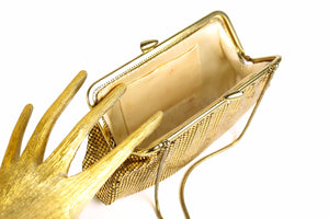 Gold mesh handbag with rhinestone clasp