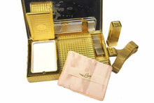 EVANS gold embossed metal vanity purse