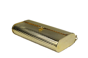 Gold metal flap clutch with diagonal engraving