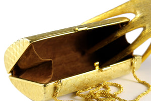 Gold metal clutch with diamond shaped engraving