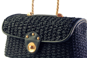 Black woven raffia box purse with metal handle