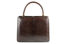 Brown lizard skin handbag with embedded watch