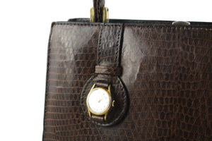 Brown lizard skin handbag with embedded watch
