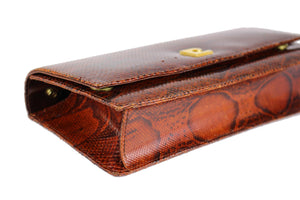 Orange-brown snake skin handbag