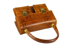 Burnt orange snakeskin handbag with two front pockets