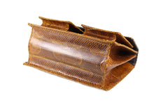 Burnt orange snakeskin handbag with two front pockets