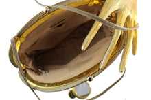JUDITH LEIBER beige snake skin clutch with semicircular jewel frame