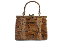 Snake skin handbag with lined frame and single handle