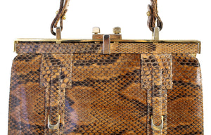 Snake skin handbag with lined frame and single handle