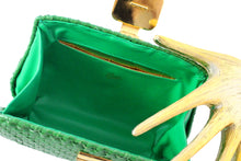 RODO green wicker clutch with gold and silver clasp