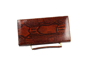 Orange-brown snake skin handbag